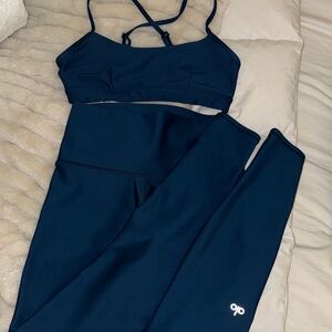 Matching Alo Airlift High-Rise leggings and bra in teal